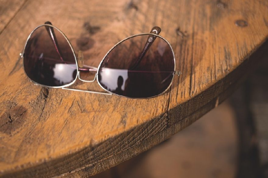 Sunglasses on a dark wooden table