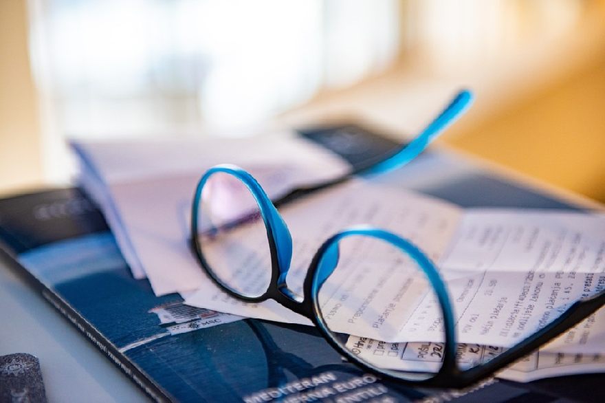 Blue glasses on a notebook