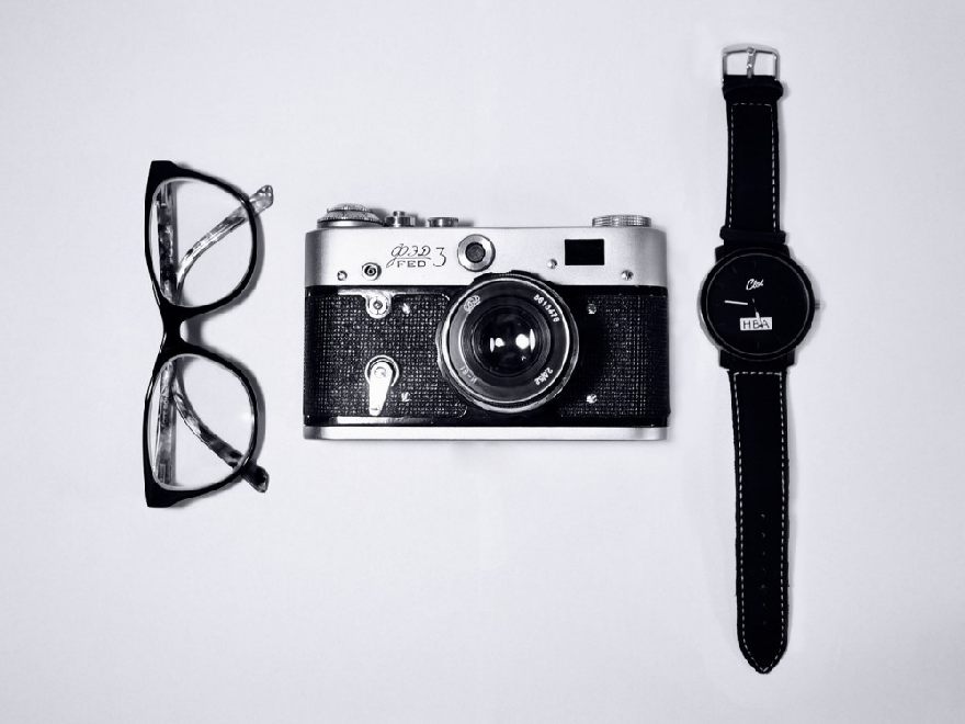 Glasses, old camera and a wristwatch