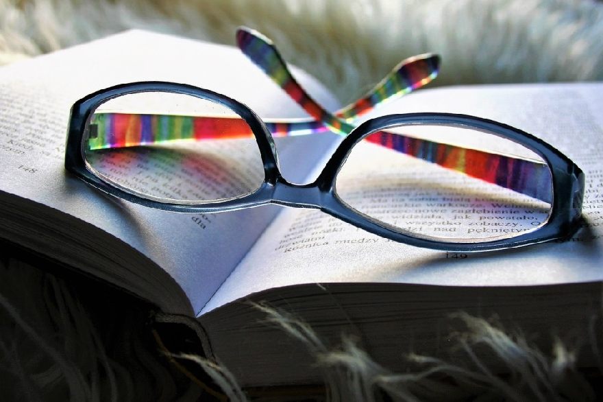 Colorful glasses on a book